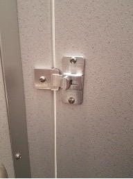 Renovated bathroom stall door handle.